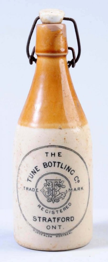 Tune Bottling Company Stoneware Beer Bottle.: This bottle is from Stratford, Ontario. Has overall soiling. Condition (Very Godd Plus). Size 9" T.