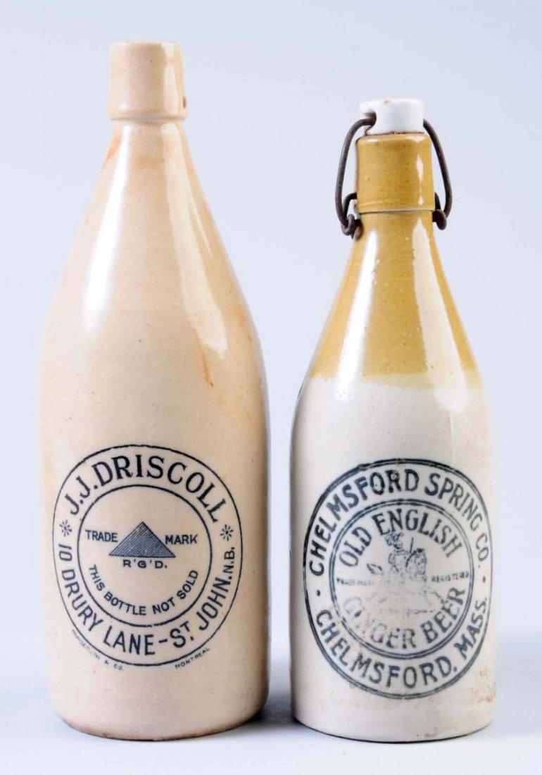 Lot of 2: Stoneware Beverage Bottles.: The first bottle is marked "Chelmsford Spring Company Old English Ginger Beer Chelmsford, Mass." The second bottle is marked "J. J. Driscoll St John, N. B." Condition (Excellent). Size Largest: 10 - 1