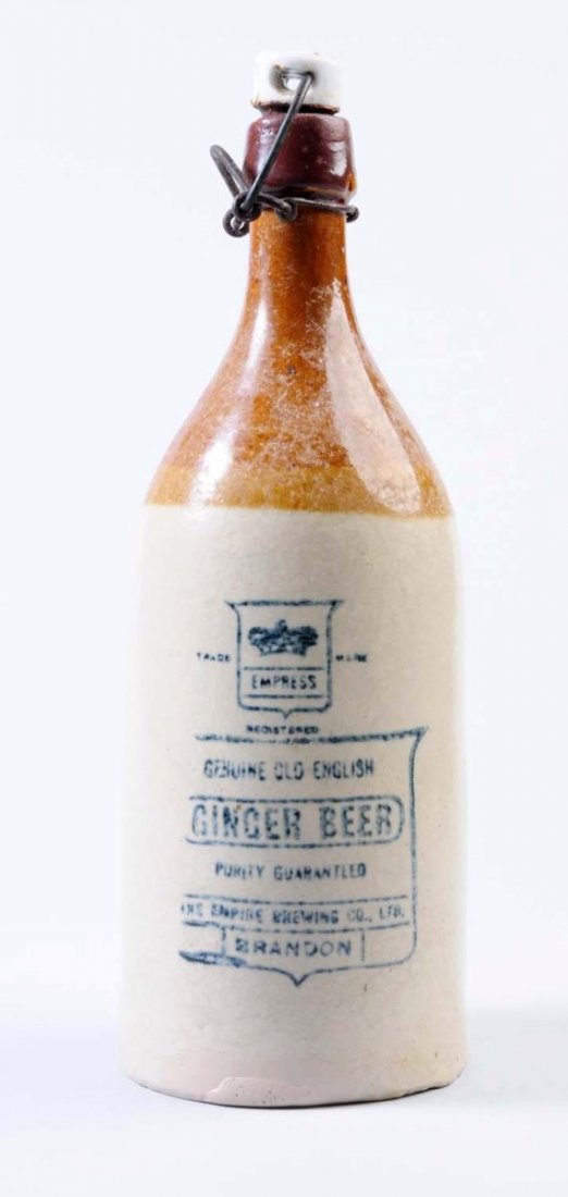 Empress Ginger Beer Stoneware Bottle.: This bottle overall soiling and several areas of repair around the base. Condition (Very Good). Size 10" T.