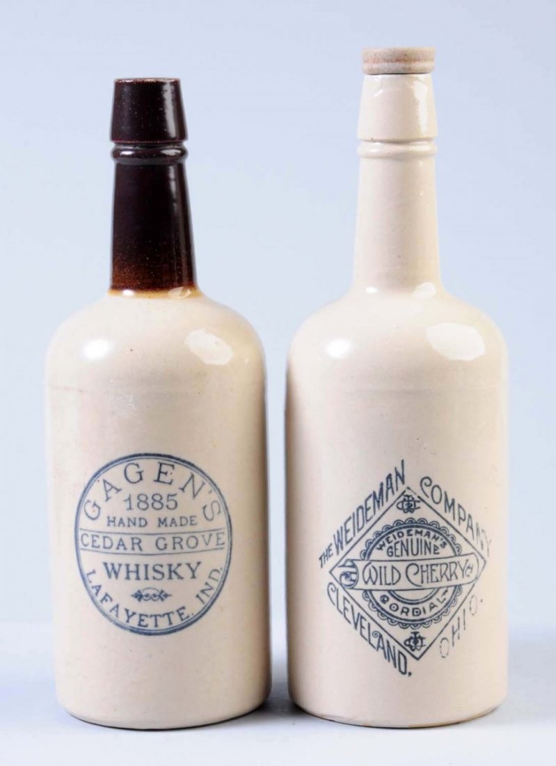 Lot of 2: One Quart Stoneware Beverage Bottles.: This lot includes: a bottle for The Weideman Company Wild Cherry Cordials from Cleveland, OH. The second bottle is for Gagen's Cedar Grove Whiskey from Laffayette, Indiana. Condition (Excellent). Size