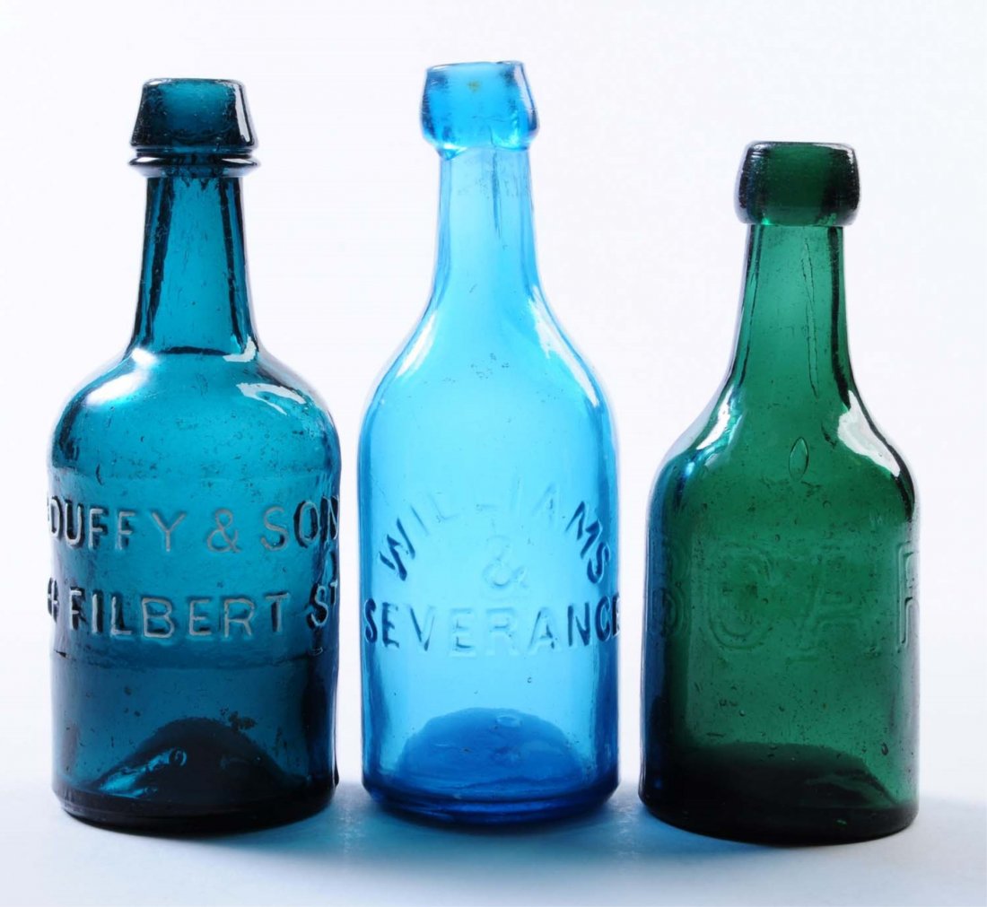 Lot of 3: Early Beer Bottles.: This lot includes: a dark green bottle embossed Boardman in large letters, a dark turquoise bottle from E. Duffy and Son and a blue Williams and Severance. No towns are mentions. The Boardman and Duff