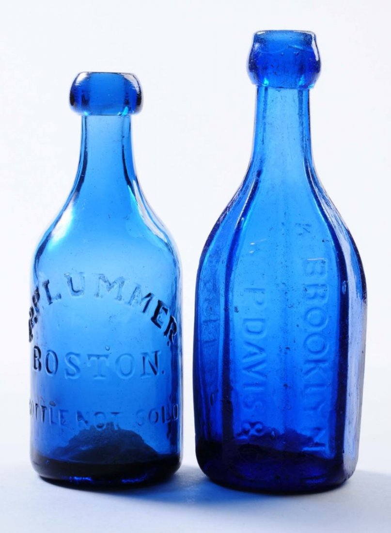Lot of 2: Early Bottles.: This lot includes: a blue octagon WM P. Davis and Co. Mineral Water bottle and a blue J.P Plummer bottle from Boston. The Davis bottle has moderate surface wear and the Plummer has minor wear to the r