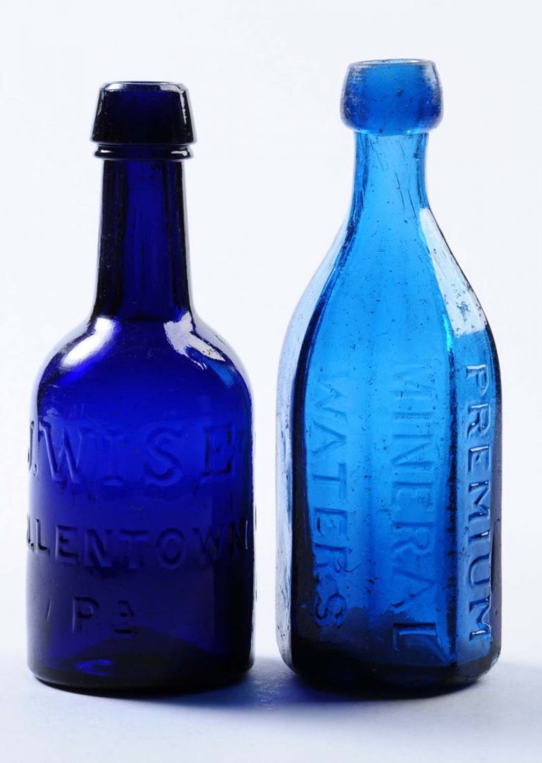 Lot of 2: Early Bottles - Pennsylvania.: This lot includes: a dark blue bottle from J. Wise in Allentown and a blue octagon bottle from Seitz and Bro. in Easton. Condition (Excellent). Size Each: 7" T.