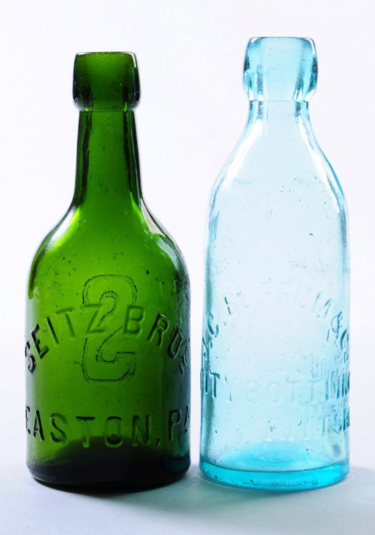 Lot of 2: Early Beer Bottles - Pennsylvania.: This lot includes: a dark green bottle from Seitz Bros. in Easton and a light turquoise bottle from J.C. Buffum and Co. in Pittsburgh. The Buffum bottle has a few chips at base. Condition (Very Good P