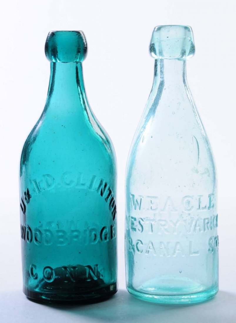 Lot of 2: Early Bottles.: This lot includes: a turquoise U. and U.D. Clinton soda water bottle from Woodbridge, CT and a W. Eagle soda water bottle. Condition (Very Good Plus). Size Each: 7 - 1/2" T.