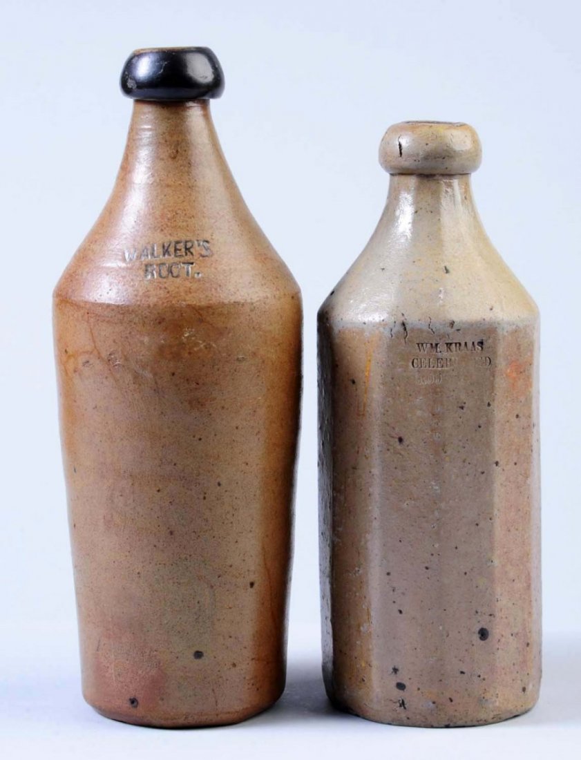 Lot of 2: Early Stoneware Root Beer Bottles.: One bottle is marked "William Craas Celebrated Root Beer" with difficult to read lettering, and the other bottle is marked "Walker's Root" and has a few hairlines. Condition (Very Good Plus). Size Lar