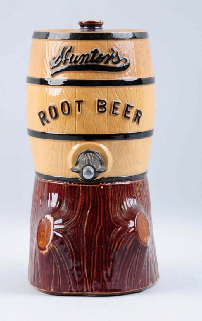 Hunter's Root Beer Syrup Keg Dispenser.: This Hunter's dispenser has some staining to the logo on the reverse, a repair to the rim, and a chip on the lid. Still displays very well. Condition (Very Good). Size 12 - 1/2" T.