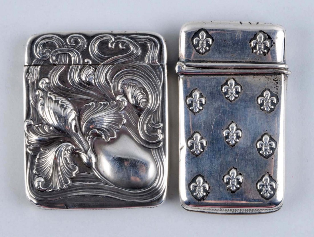 Lot of 2:Sterling Silver Floral Match Safe Vestas: Includes one by Bigalow Kinnara Co. Strong hinges. No dents. Condition (Excellent). Size Each: 2 - 1/2" L.