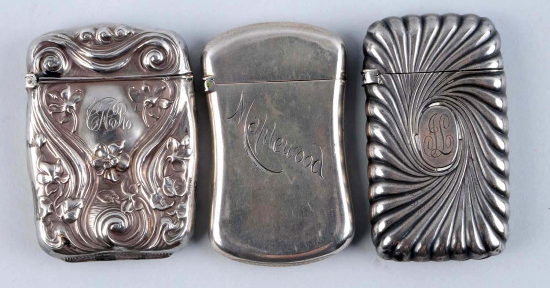 Lot of 3: Sterling Silver Match Safe Vestas.: Includes one scroll pattern with initials by Gorham & Co., one art noveau dated 1916 and one marked Maplewood by Kent & Stanley. All with strong hinges. Condition (Excellent). Size Largest: 2 - 1/2" L