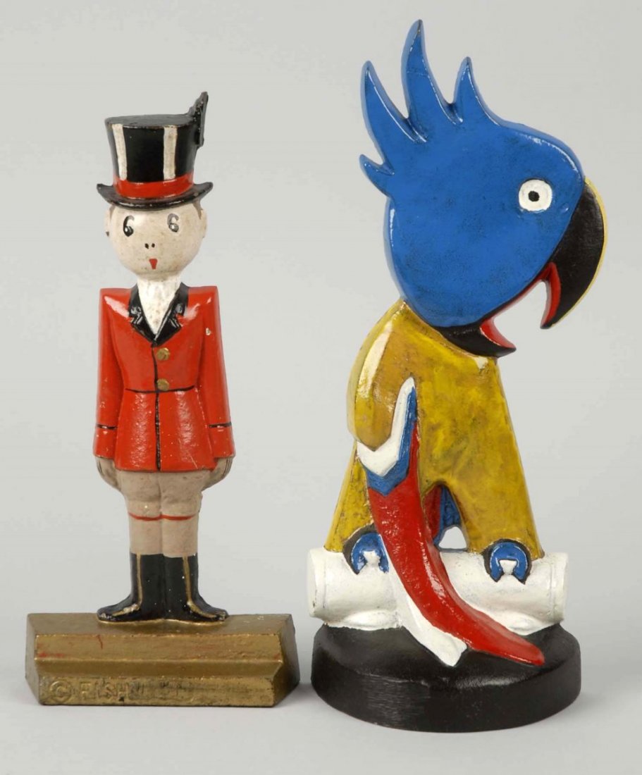 Lot of 2: Cast Iron Tiger and Parrot Doorstops.: Tiger (Huntsman) – Hubley, “© Fish, 269”; Parrot – “Taylor Cook No. 4, © 1930”. Each repainted. Condition (Good). Size Largest : 10 ½" L.