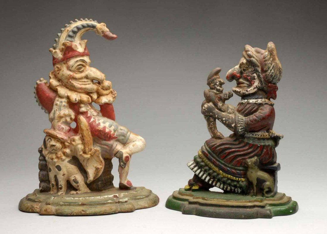 Lot of 2: Cast Iron Punch and Judy Doorstops.: Punch reproduction, Judy repainted. Condition (Good). Size Tallest: 12" T.