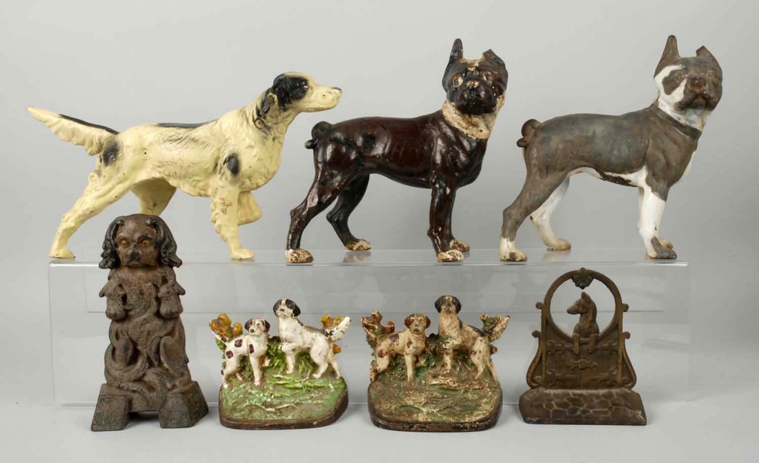 Lot of 7:Cast Iron Assorted Dog Doorstops Bookend: Two Boston Terriers each have broken ears. Setter doorstop and setter bookends are reproductions. Condition (Good). Size Tallest: 10" T.