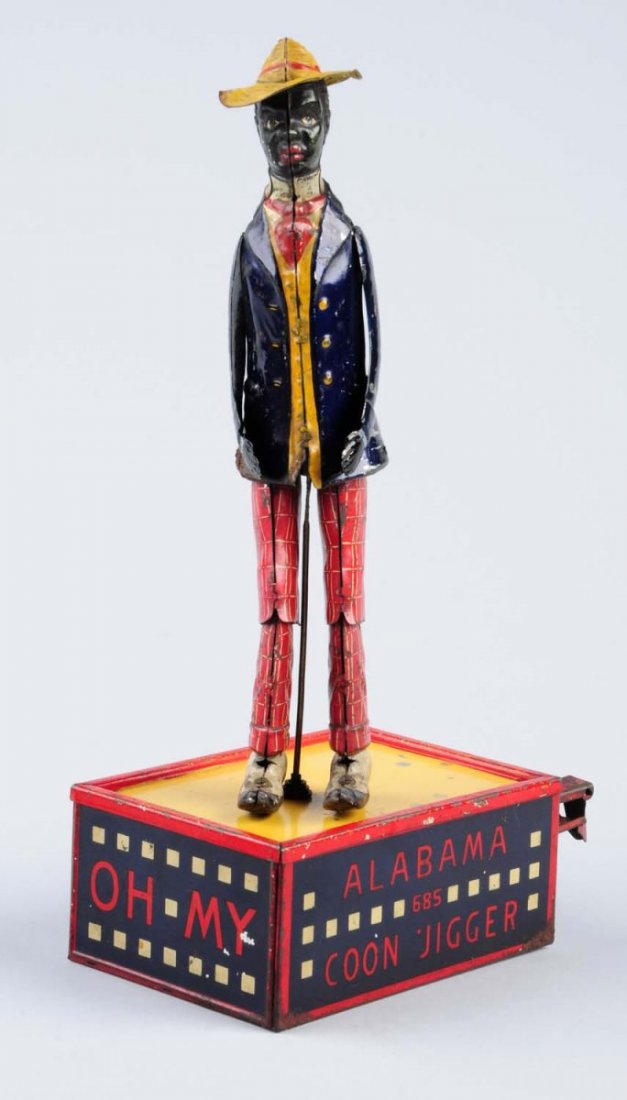 Tin Wind - Up Coon Jigger.: Toy has some litho scratches, loss and oxidation. Has nice colors. Arms and legs move. Condition (Good - Very Good). Size 10" L.CORRECTION: The arms have been replaced.