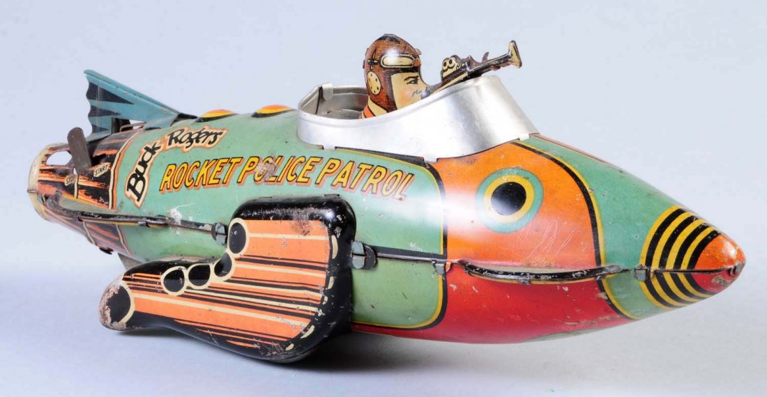 Marx Tin Wind - Up Rocket Police.: Has significant litho scratches throughout toy as well as some oxidation. Toy is in working condition. Condition (Good). Size 12" L.
