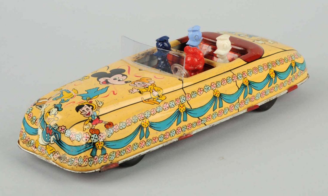 Marx Tin Wind-Up Disney Car.: Car has significant litho scratches, chips, and oxidation throughout the car. Includes original key. Condition (Very Good). Size 11" L.