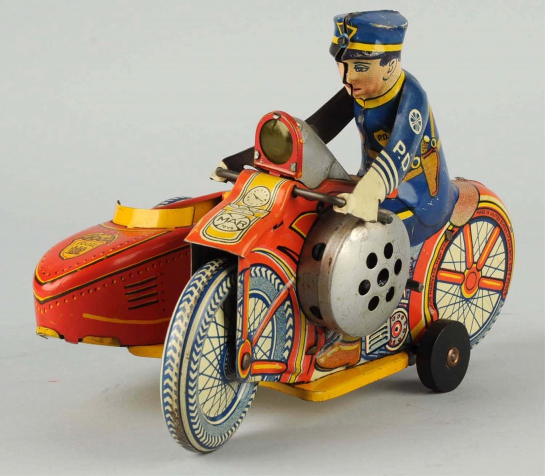 Marx Tin Wind - Up Policeman Toy.: Few scratches on litho throughout toy, otherwise toy is covered with beautiful and colorful litho colors. Tin policeman riding on a motorcycle includes tin arms holding motorcycle steering mechanism. 