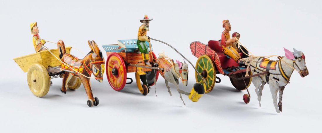 Lot of 3: Tin Wind - Up Hee Haw the Wagon.: The first one is made by Ferdinand Strauss Corp.; Called "Jenny the Balking Mule". Has some litho scratches and some oxidation. The second one is made by Marx; it is a mule pulling a cart with driver.