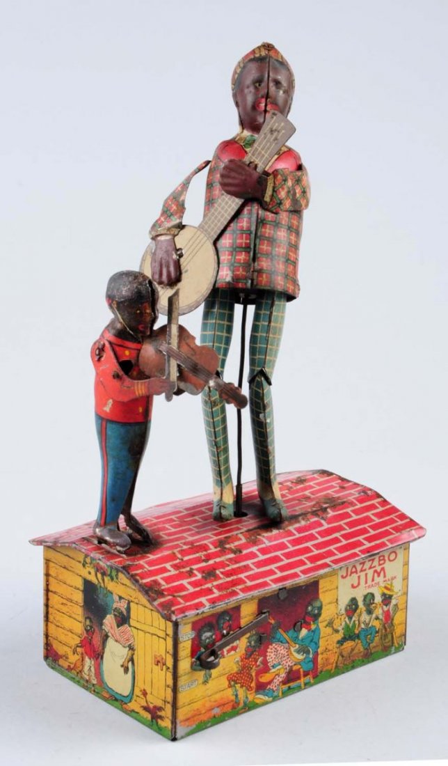 Marx Tin Wind - Up Jazzbo Jim.: Entire toy has litho loss, scratches and chips. Also has some oxidation mainly toward the musicians and roof of the barn. Remaining litho colors are attractive. Condition (Good). Size 10" T.