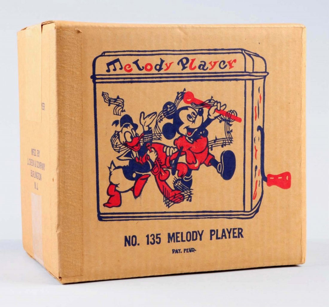 Mickey Mouse Melody Player With Box.: Toy is in box sealed, never been open. Box is in excellent condition. Box depicts Mickey Mouse and Donald Duck playing and dancing to the music. And says "Melody Player NO. 135" on larger sides of box