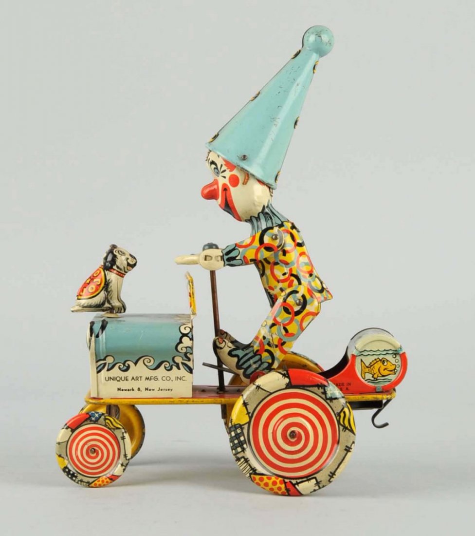 Unique Art Tin Wind-Up Artie Car.: Some slight scratches to the litho of the car. Condition (Very Good - Excellent). Size 7" L.