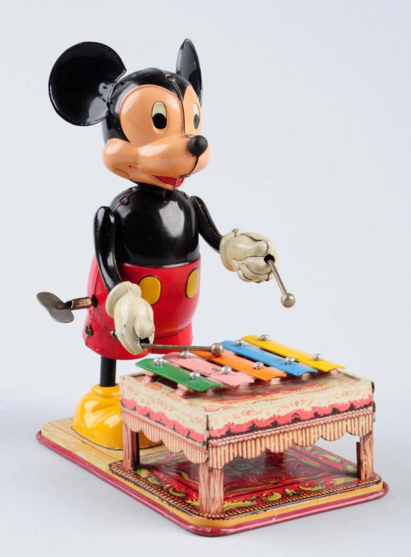 Linemar Tin Wind-Up Mickey Mouse Playing Cymbals.: Toy has a couple minor litho scratches where Mickey hits the cymbals. Very clean toy. Includes its original key, drumsticks, and Mickey's tail and ears. Condition (Excellent - Near Mint). Size 7" L.CO