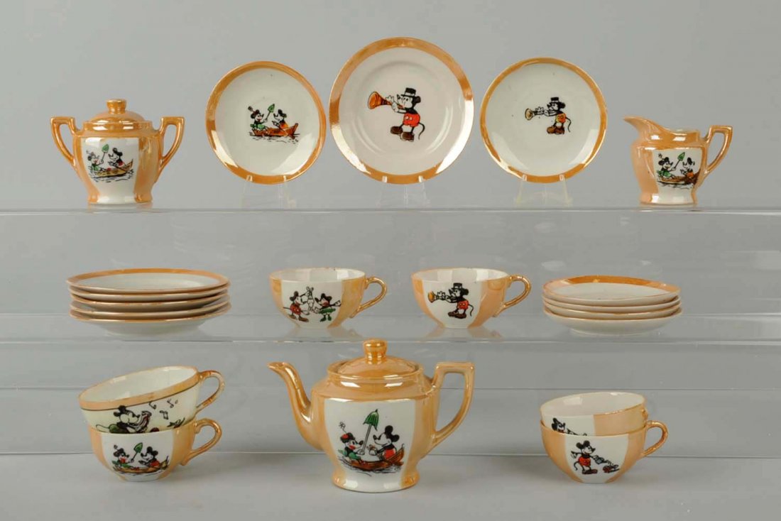 Mickey Mouse Tea Set.: Made in Japan. Includes original box. Set includes 12 saucer plates, six teacups, a sugar, creamer, and a bowl for tea. Box has slight paper tears and loss. Condition (Excellent - Near Mint). Size Lar