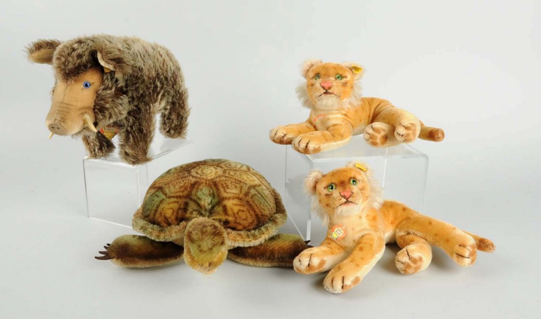 Lot of 4: Steiff Animals.: Includes three with buttons and one with missing button. All have glass eyes. Condition (Good). Size Largest: 14" L.
