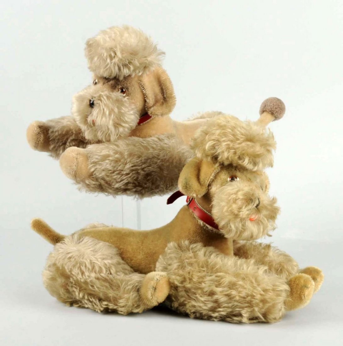 Pair of Vintage Steiff Poodles.: Glass eyes. Both have buttons. Condition (Good). Size Each:14" T.