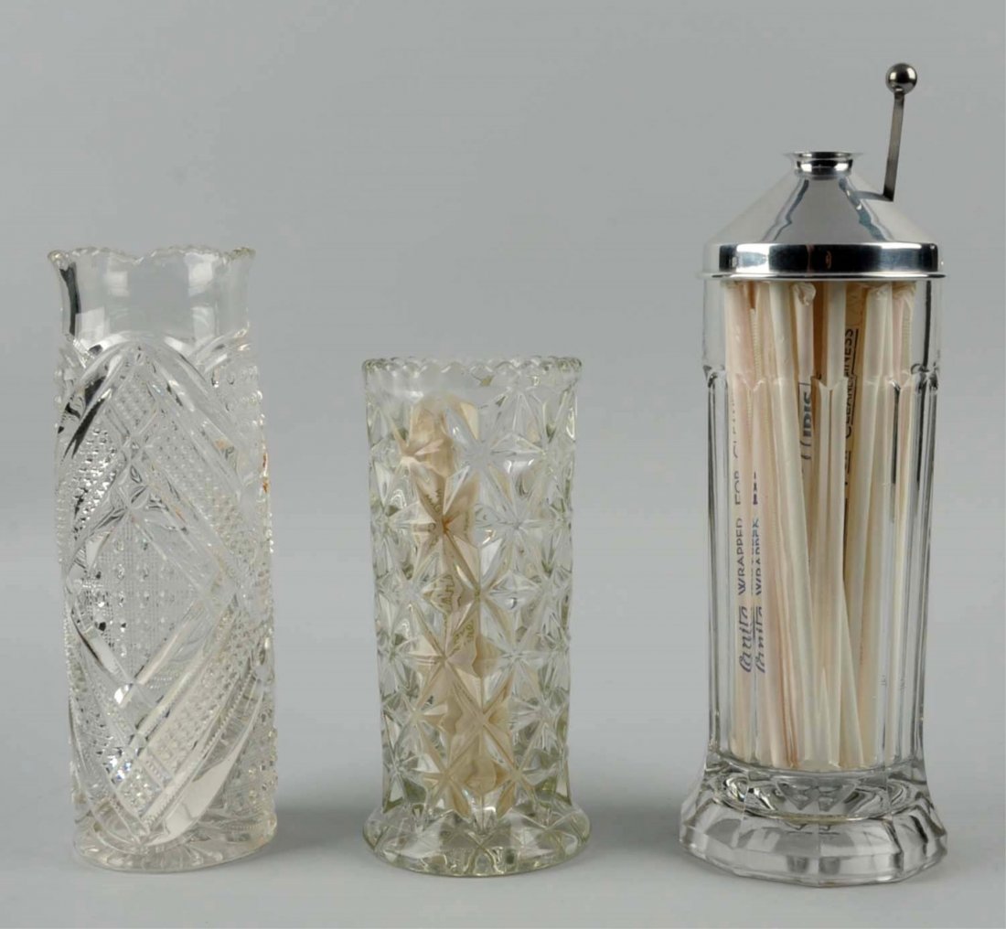 Lot of 3: Early Straw Jars.: Lot includes a Hob-Nail with zipper pattern, a unique straw holder that allows you to pull out on straw at a time, and a patterned glass straw holder. No damage to any piece. Condition (Excellent). Si