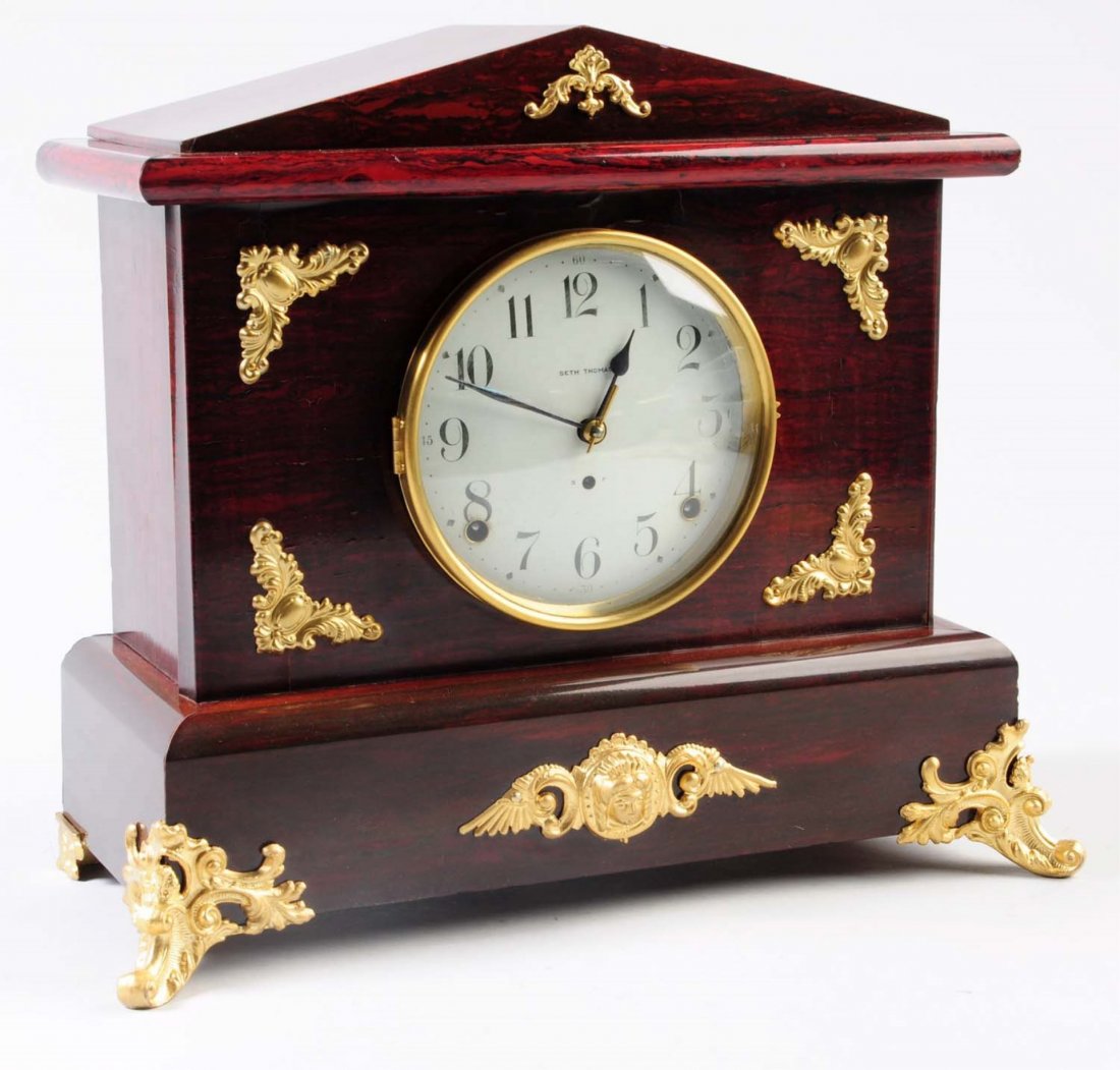 Seth Thomas Wooden Mantle Clock.: This Seth Thomas mantle clock is in great condition and includes a Seth Thomas certificate. Condition (Excellent). Size 12" T.