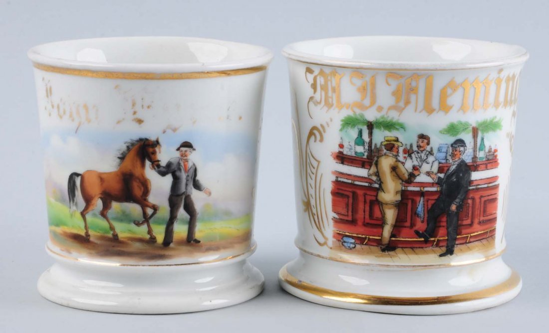 Lot of 2: Barber Shaving Mugs.: One with a man pulling a horse, and washed out name, "Limoges" on bottom, chip on base near handle. Man riding a hay wagon with horse, "Louis Schafer". Condition (Excellent).