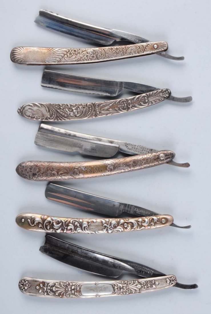 Lot of 5: Sterling Razors.: Lot includes: a Electric Cutlery Co. sterling handled straight razor done in fancy scroll and geometrics, circa 1890s; a Friedr. Ern & Co. sterling handled straight razor don in fancy high relief scro