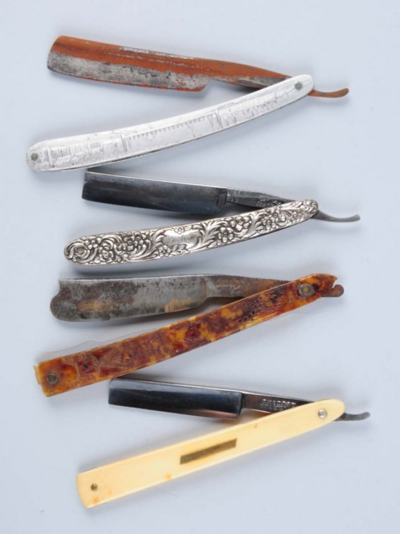 Lot of 4: Razors.: Includes The Electric Cutlery Co. Newark, NJ circa 1890-1925 straight razor done in high relief sterling. Handles are profusely covered in floral and vines. Second is a Midely circa 1820s early presse