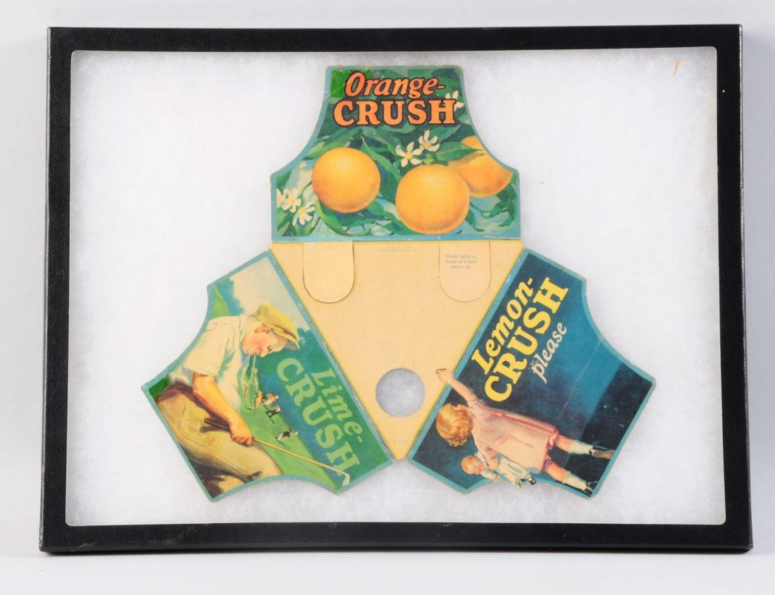 1930s Crush Three Flavor & Three Bottle Display.: Two flaps fall and one rises when displayed properly with three bottles. Light wear, with a small retouched spot and some closed break tape repair on back at natural fold lines. Condition (Excellent).