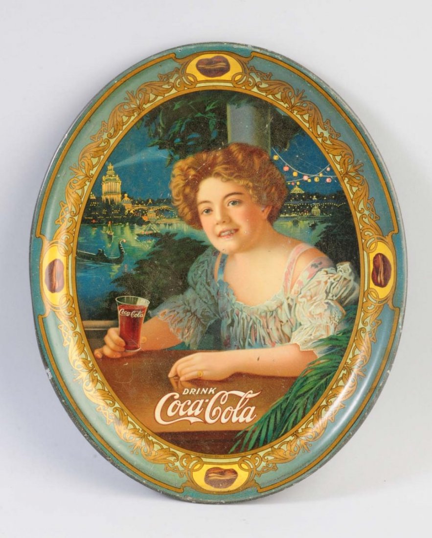 1909 Coca-Cola Small Oval Serving Tray.: Medium wear and crazing, with a light clear coat. Condition (Very Good). Size 13" L.