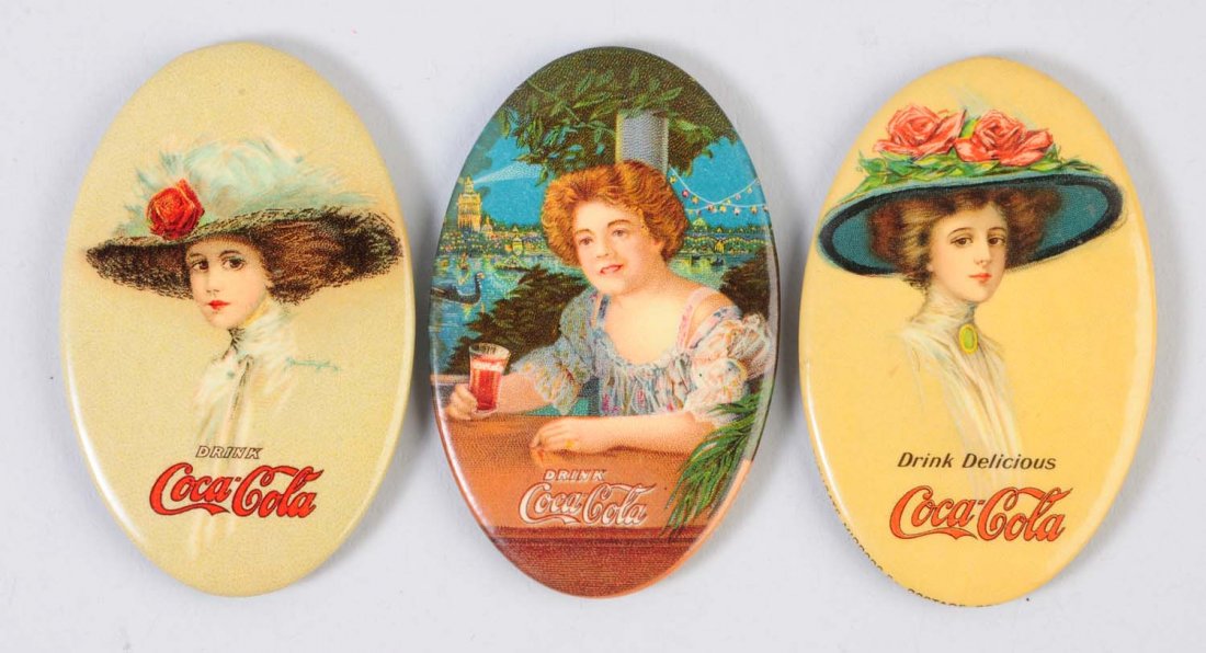 Lot of 3: 1909 - 1911 Coca-Cola Pocket Mirrors.: This lot includes mirrors from 1909, 1910 and 1911. Minor wear to the fronts. The 1909 mirror has heavy loss to the reverse. Condition (Excellent). Size 2 - 3/4" L.