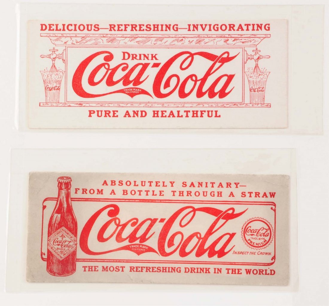 Lot of 2:Early Coca-Cola Blotters.: This lot includes blotters from 1909 and 1910. The 1909 blotter is very clean and bright. The 1910 blotter does have a number of corner creases, small tear and some discoloration. Condition (Very Good