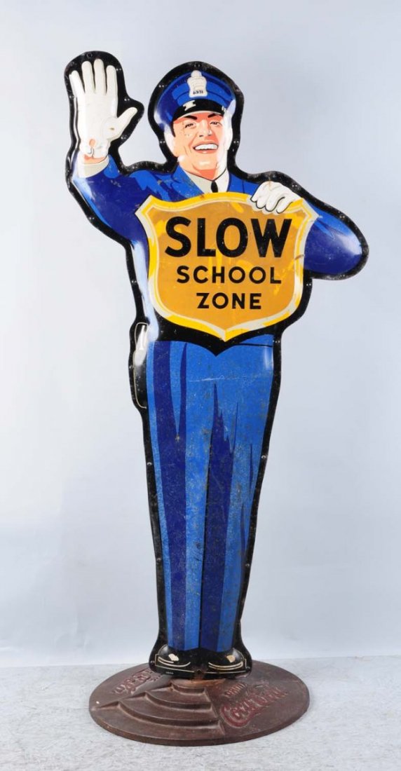 Coca-Cola Policeman Slow School Zone Sign.: This sign has light to moderate overall wear. Some light rust spots. Condition (Very Good). Size 62" T..
