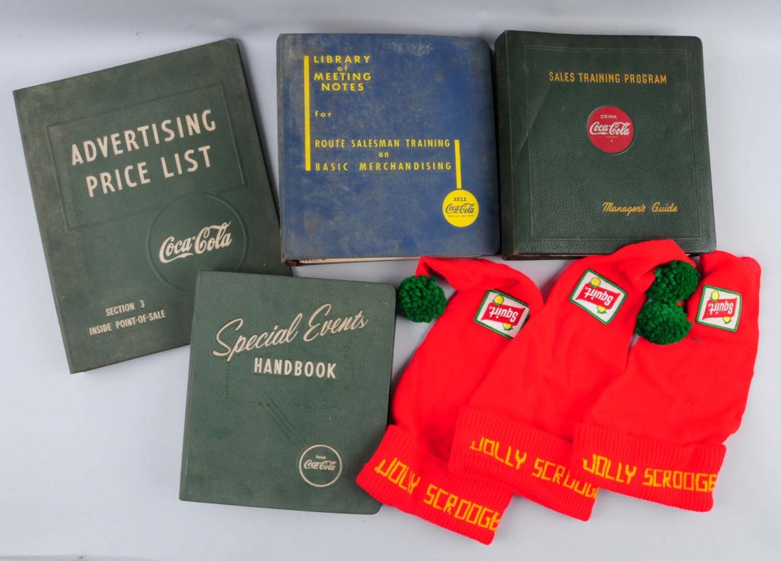 Embossed Coca-Cola Binders and Stocking Hats.: In fair to good condition.