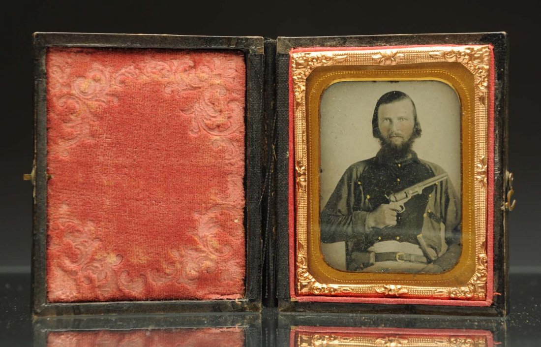 Ambrotype of a Soldier Holding Gun.: 1/9th plate 2" x 2 - 1/2". Clean image in leather case. Condition (Excellent). Size 3 " L.
