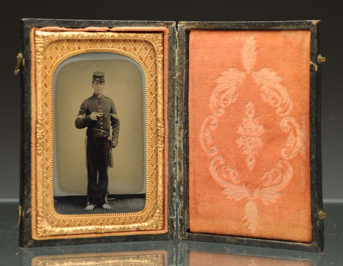 Ambrotype of Civil War Soldier Holding Gun.: 1/6 plate. Clear image. Leather case separated. Has lock of hair. Condition (Excellent). Size 4 - 1/4" L.