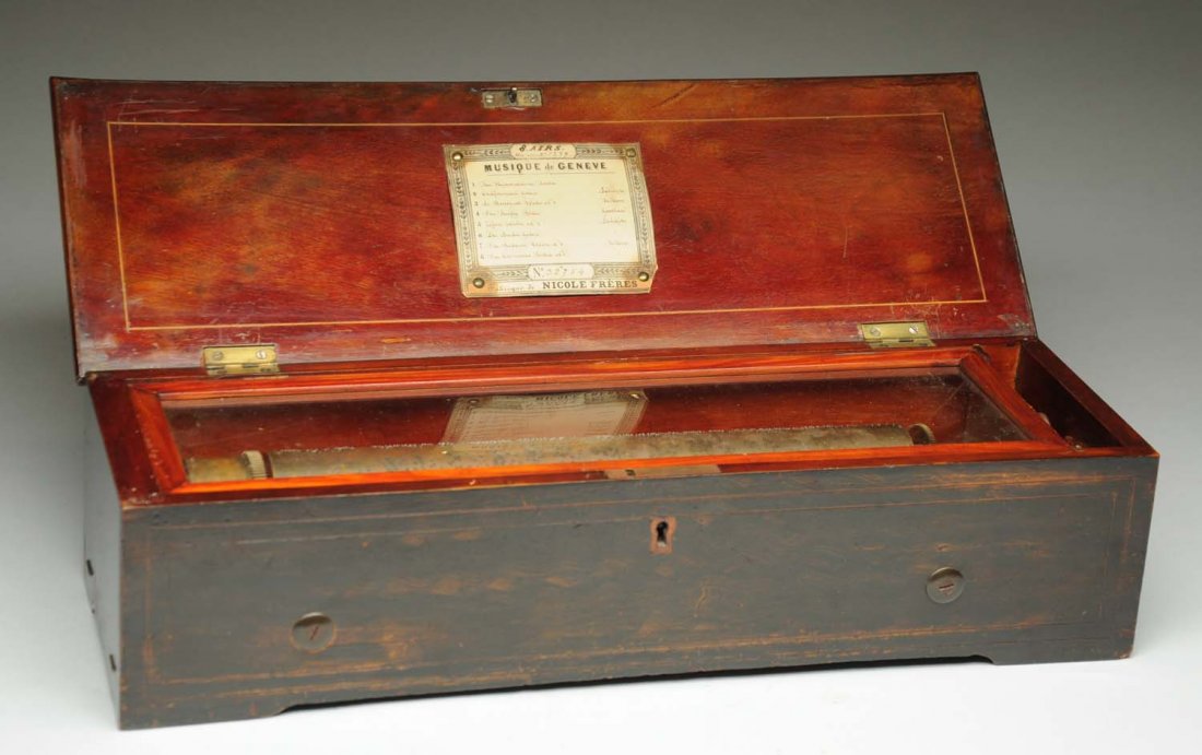 Nicole Freres 8 Tune Cylinder Music Box SN-32754.: A Nicole Freres 8 tune music box in unrestored condition. The 13 - 1/8” cylinder plays on a 97 tooth comb. The movement is contained within a grain painted case with a nice inlaid lid and original t