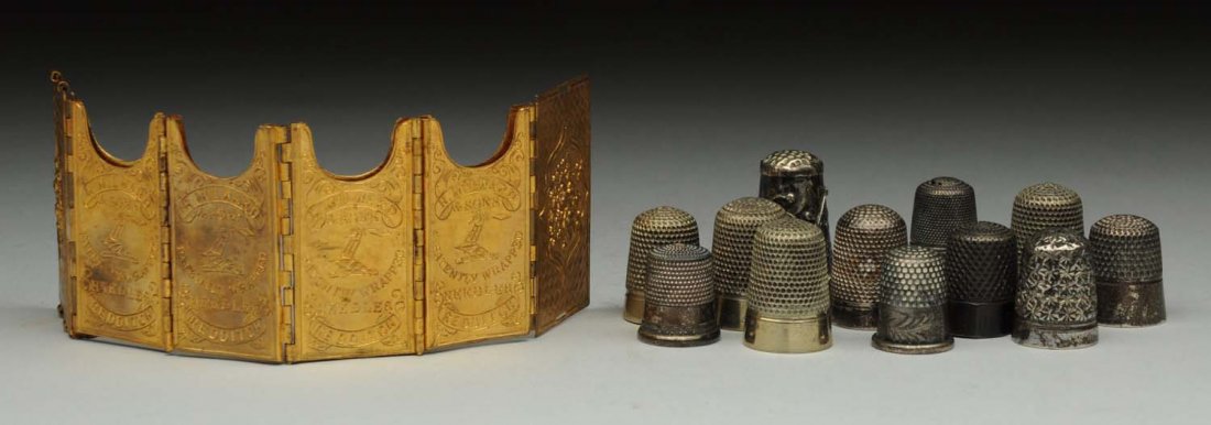 Lot of Sewing Pieces.: 11 Sterling thimbles and one Avery accordion style with four pockets for needles. Condition (Excellent). Size Largest : 2" L.