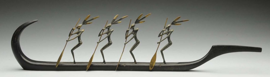 Hagenauer Grouping of Native Americans on Canoe.: Bronze and hand carved wood. Front of canoe repaired. Unsigned. Condition (Very Good). Size 20 - 1/2" x 4 - 3/4".