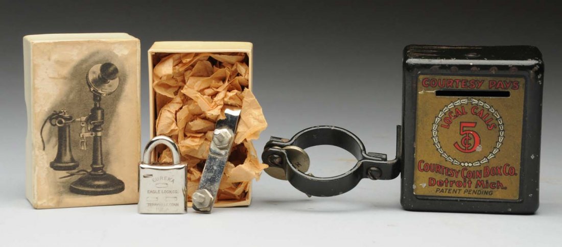 Lot of 2: Courtesy Coin Box & Bielitz Lock.: This lot includes: Five cent courtesy coin box attaches to candlestick shaft, key included. And Bielitz telephone locking device to hold down hook on taper shaft phone, in box, all there including two