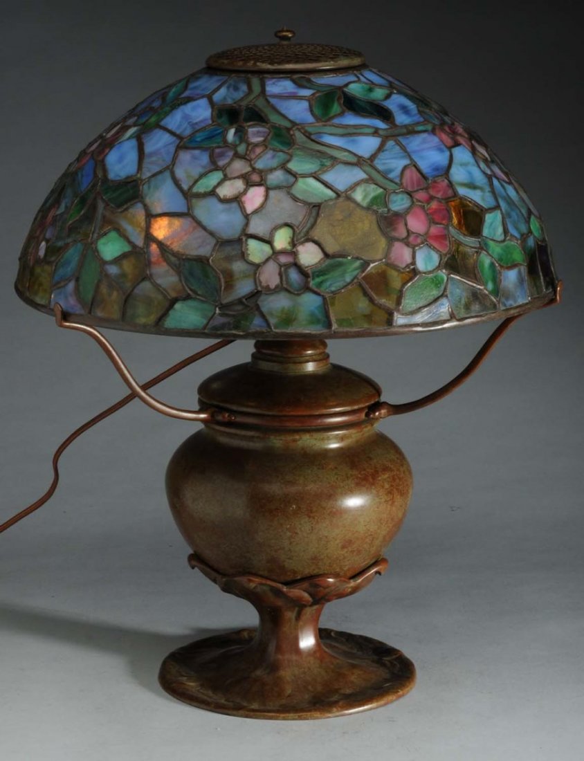 Reproduction Tiffany Lamp: Floral Pattern.: 1960's reproduction signed Tiffany Studios New York shade, no. 1455, with reproduction Tiffany base. Lots of confetti glass. Condition Excellent. Size Shade 16" D.