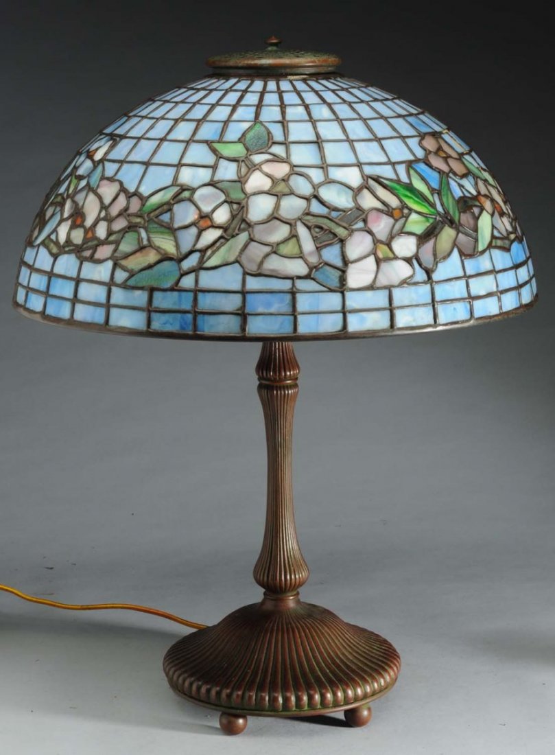 Reproduction Tiffany Lamp: Floral Pattern.: 1960's reproduction signed Tiffany Studios New York shade with reproduction Tiffany base. Condition Excellent. Size Shade 18" D.
