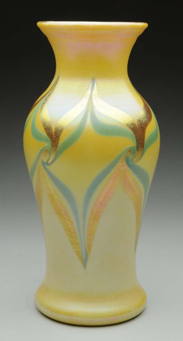 Tiffany Favrile Vase.: A large favrile vase from the early Tiffany Corona Period with a geometric pattern in green and gold over a cream colored back round. Beautiful gold iridescence over the double pulled geometric decora