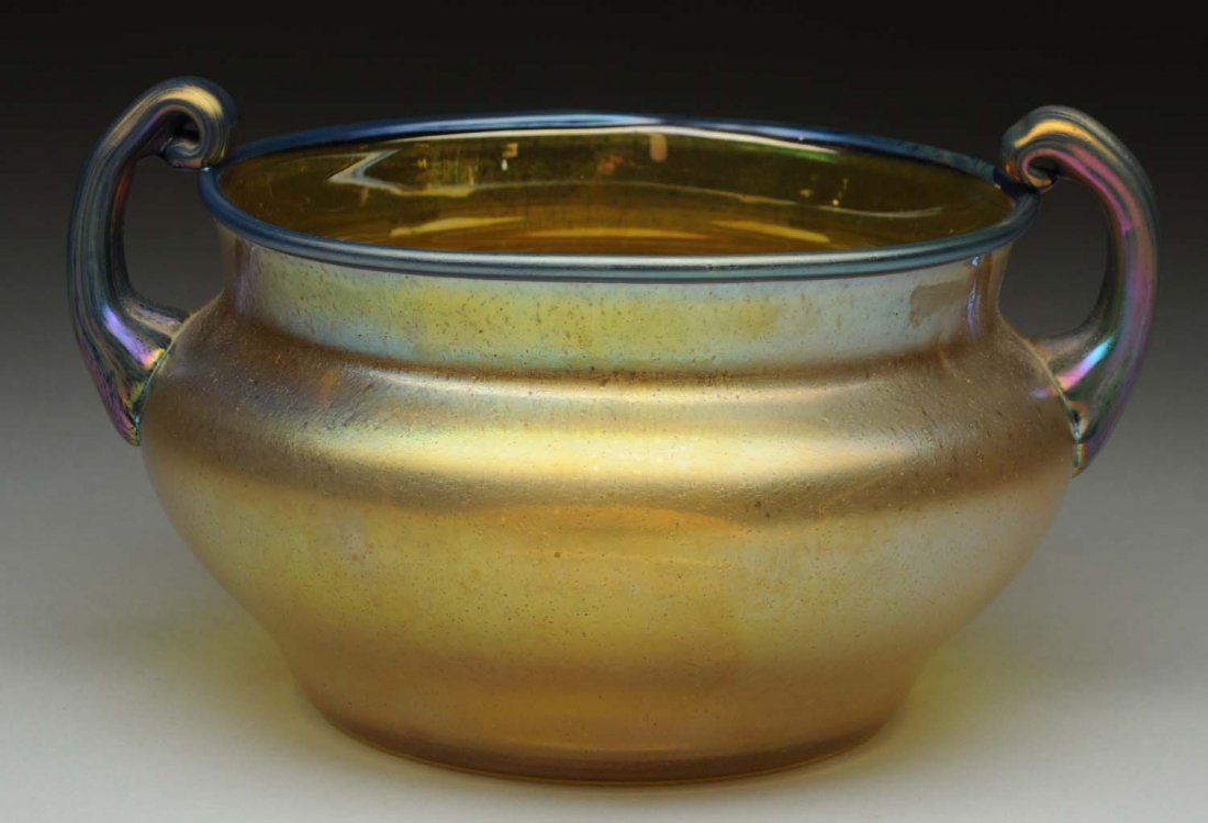 Loetz Gold Vase with Blue Handles.: Loetz candia silberiris vase with cobalt papillion scroll handles. Signed on base with the oval Czechoslovakia acid mark. Condition (Excellent). Size 7 - 1/2" L.