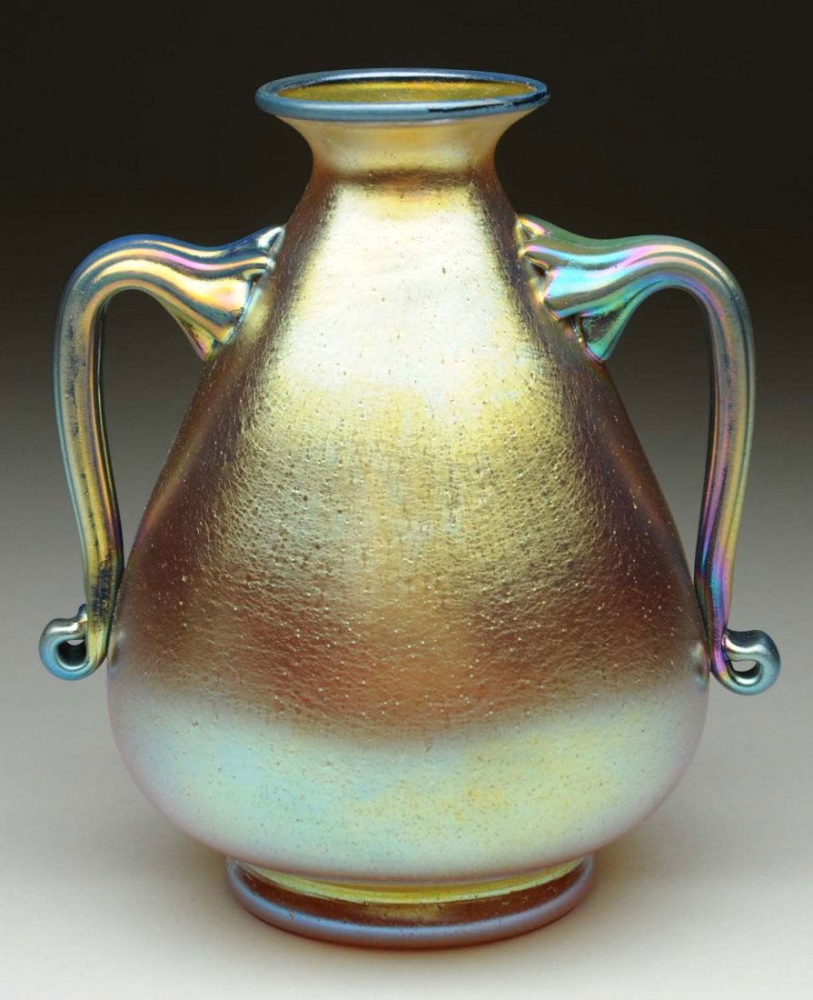 Loetz Yellow Vase with Blue Handles.: Loetz candia silberiris vase with cobalt siberiris applied handles and rim. Superb execution in form and finish make this a top quality collector piece. Signed on base with the oval Czechoslovakia aci